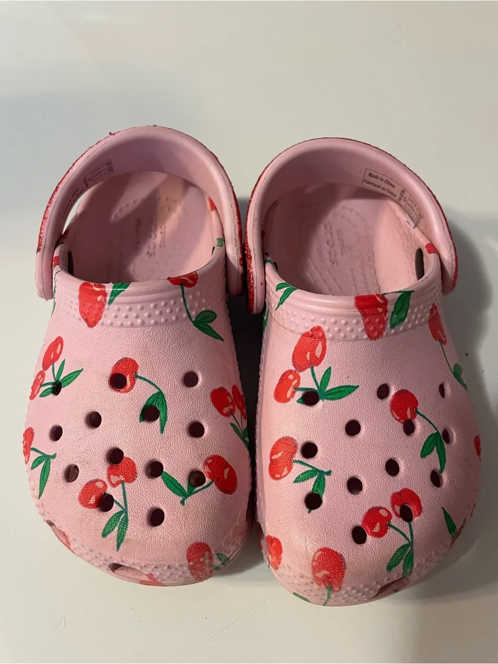 CROCS Kids Pink Clogs with Red Cherry Print and Red Glitter Strap